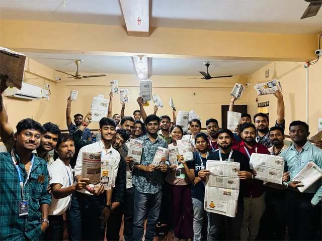 A group pictured holding newspapers in The Drop Organization official gallery.
